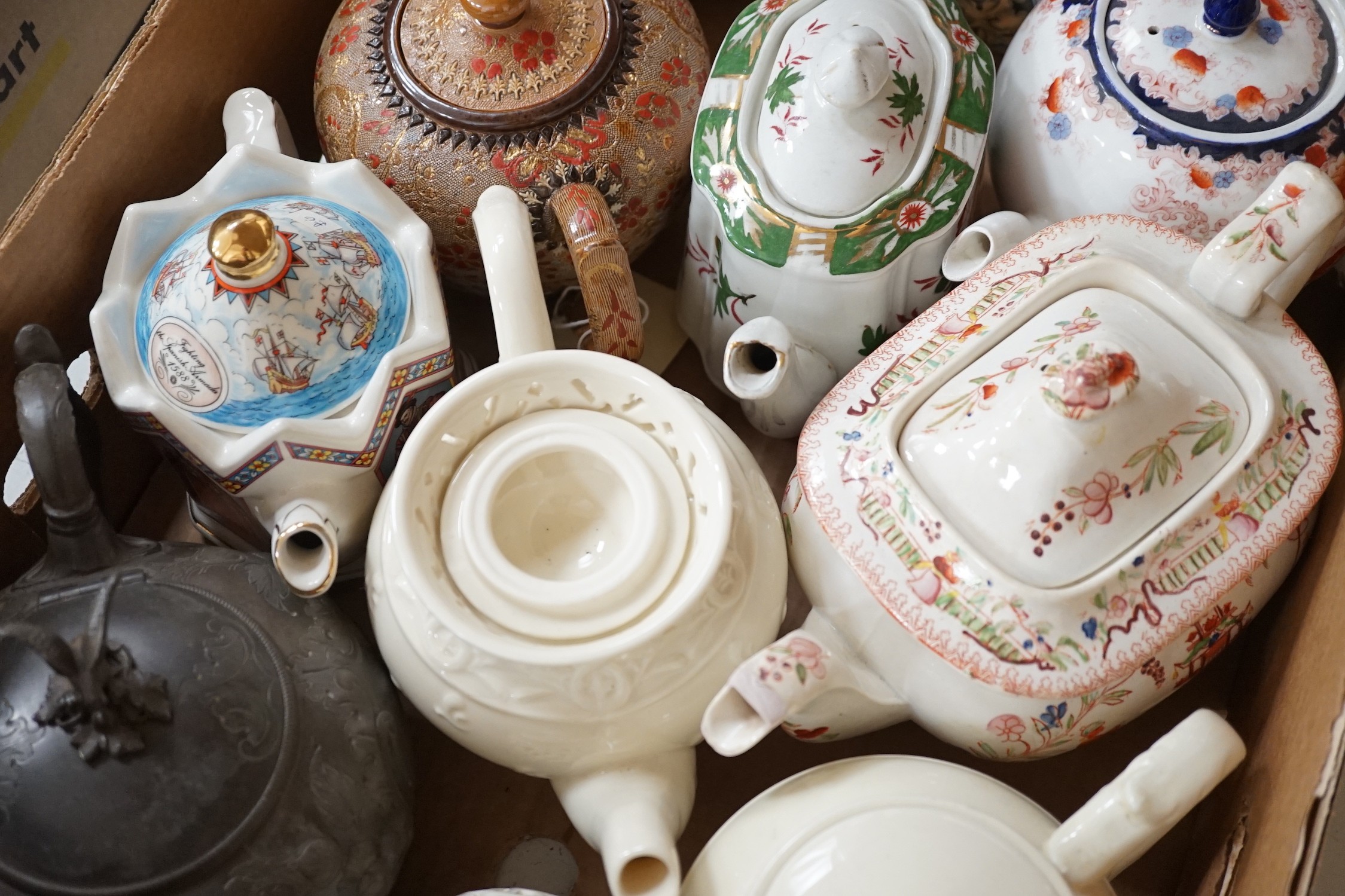 A quantity of various teapots including Doulton, Sadler etc.